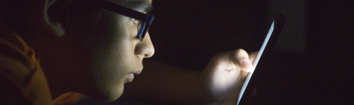 Boy reading text messages